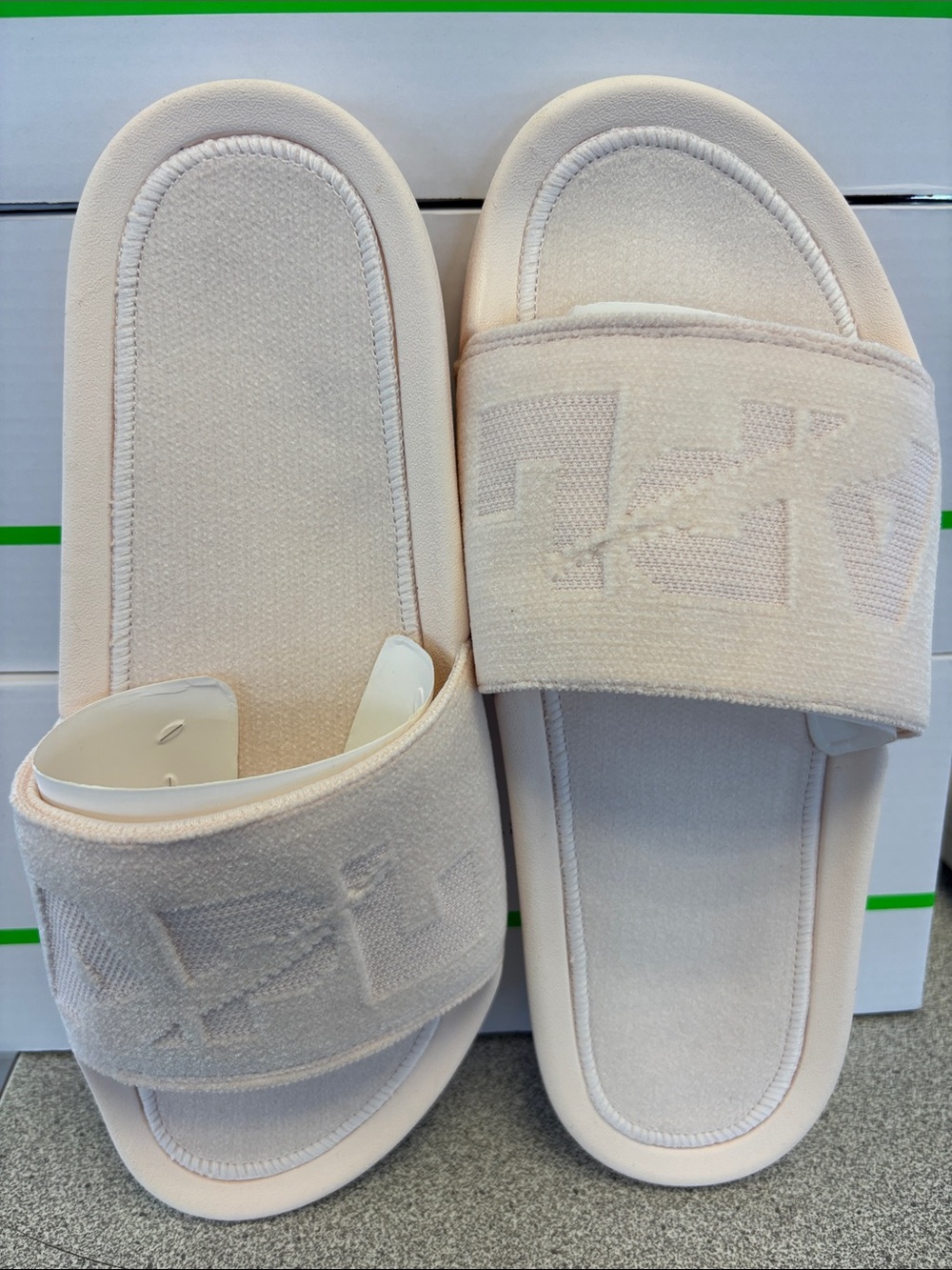 APL Women's Techloom Velvet Slide in Creme it has a slight pinkish hew